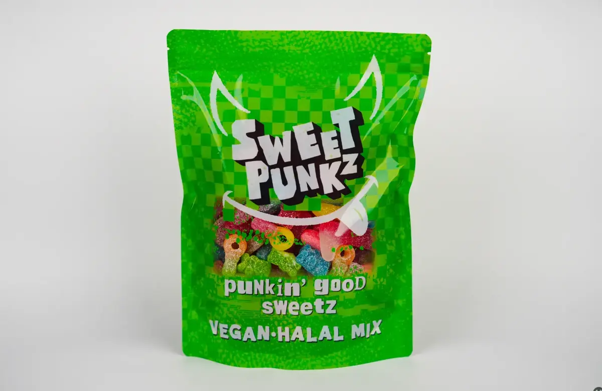 Studio product photograph of a green Sweet Punkz Vegan Halal Mix sweets bag standing upright against a clean light backdrop.