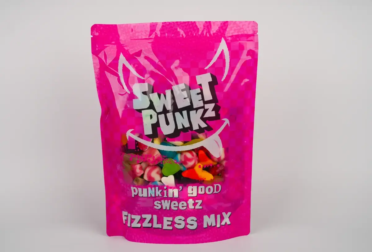 Studio product photograph of a pink Sweet Punkz Fizzless Mix sweets bag standing upright against a clean light backdrop.